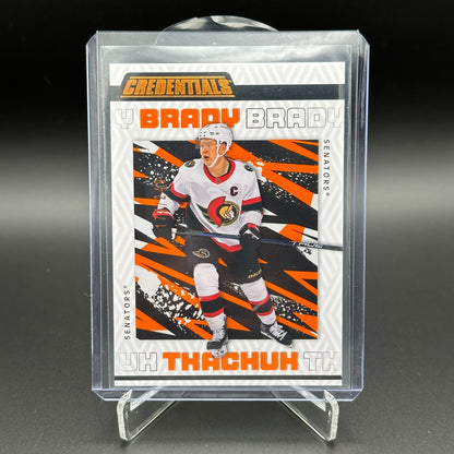 2023-24 UD Credentials BRADY TKACHUK #66 Orange /249 - Ottawa Senators